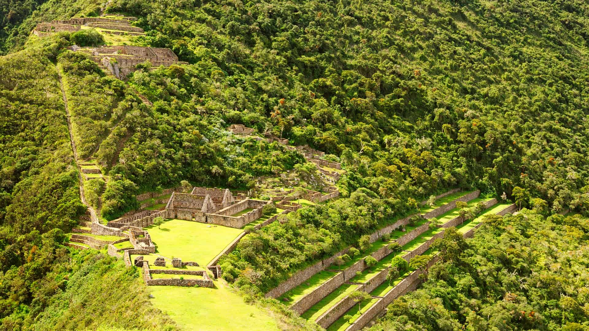 Choquequirao - A breathtaking view of the ancient Inca ruins of Choquequirao, surrounded by the Andes mountains.