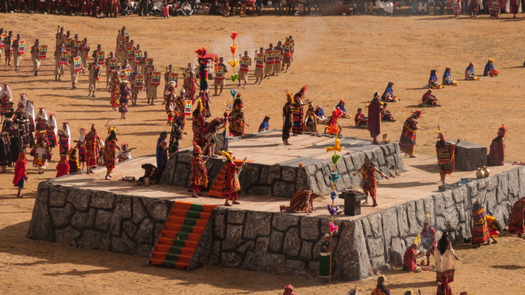 Inti Raymi ceremony at Sacsayhuamán, an ancient celebration of the Inca Empire, featuring actors dressed as Incas performing rituals in honor of the Sun - Authentic Incan Adventure.
