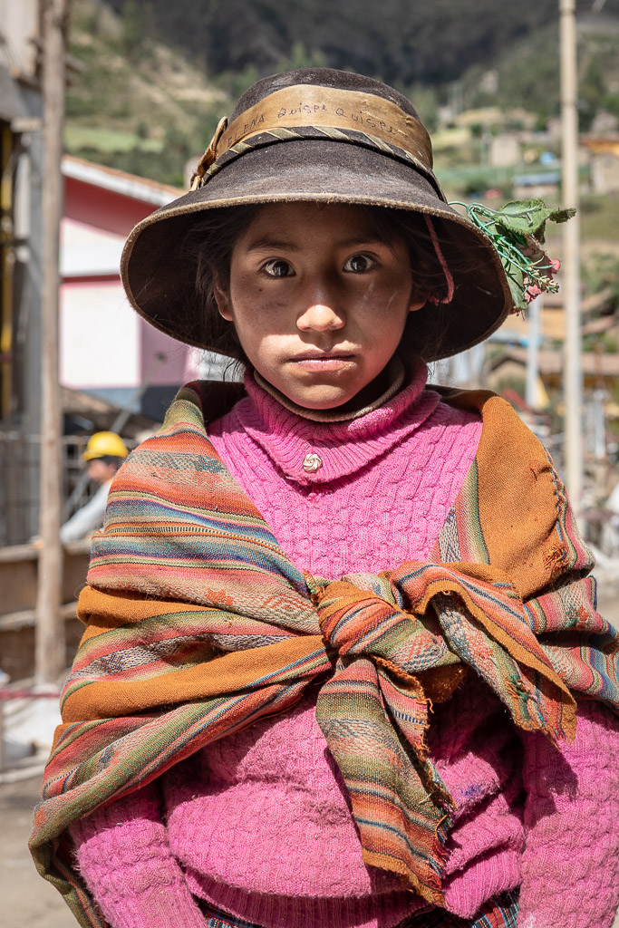 Girl from the Patacancha valley with a hat and an Andean shawl