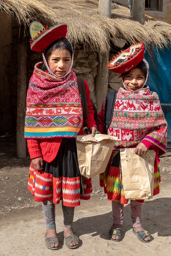 Girls from the Patacancha valley wearing monteras and hand-woven llicllas